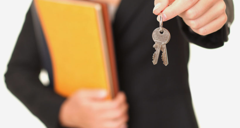 Real estate agent holding keys