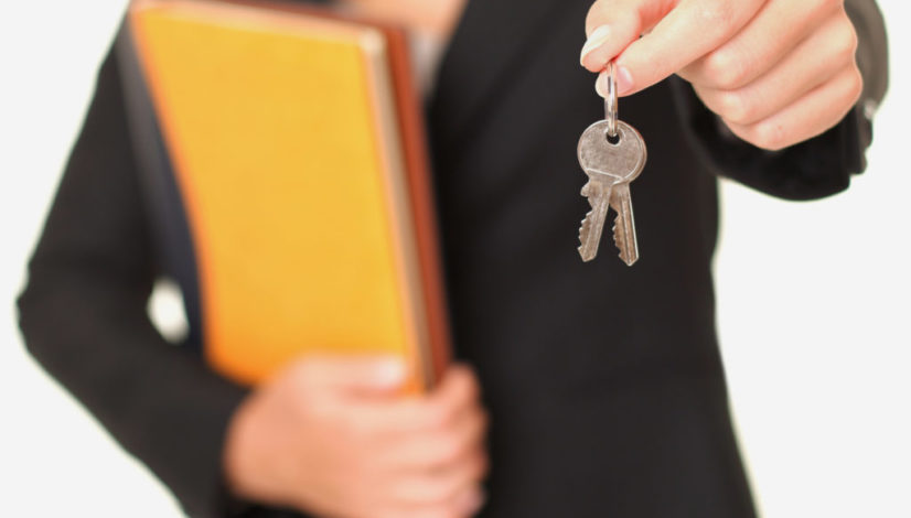 Real estate agent holding keys